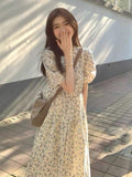 Summer 2026 New Seaside Holiday Temperament Floral Dress Orange Tea Break French Dress Girl Loose